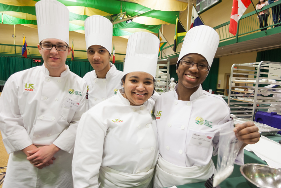 diverse group of smiling culinary students.